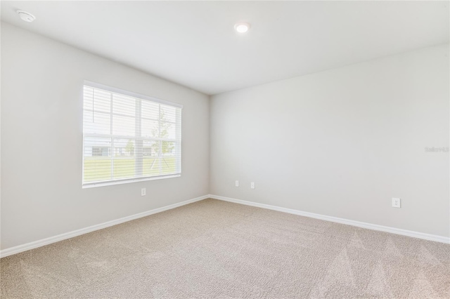 2047 Royal Tern Cir, Punta Gorda, FL 33983 - spare room with light colored carpet and a smoke detector