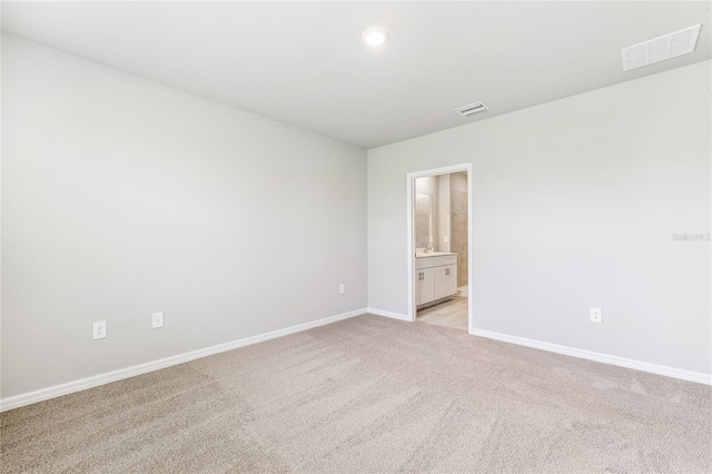2047 Royal Tern Cir, Punta Gorda, FL 33983 - spare room featuring light carpet and recessed lighting