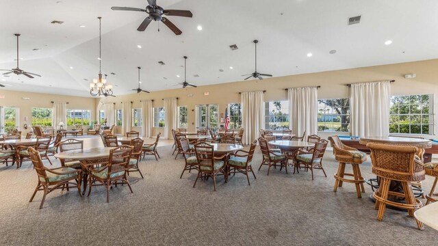 2047 Royal Tern Cir, Punta Gorda, FL 33983 - dining area with a ceiling fan, recessed lighting, high vaulted ceiling, and carpet floors