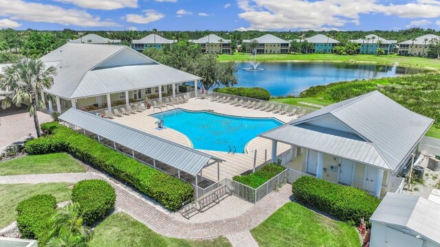2047 Royal Tern Cir, Punta Gorda, FL 33983 - community pool featuring a water view, a residential view, and a patio area