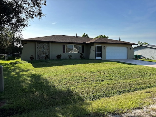 4222 Cockrell St, Port Charlotte, FL 33948 - single story home with stucco siding, an attached garage, and driveway