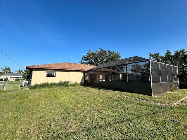 4222 Cockrell St, Port Charlotte, FL 33948 - back of house with stucco siding and glass enclosure
