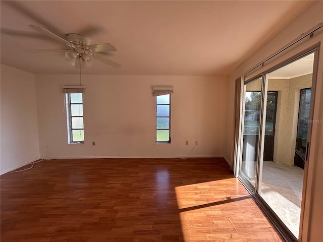 4222 Cockrell St, Port Charlotte, FL 33948 - spare room featuring plenty of natural light, wood finished floors, and a ceiling fan
