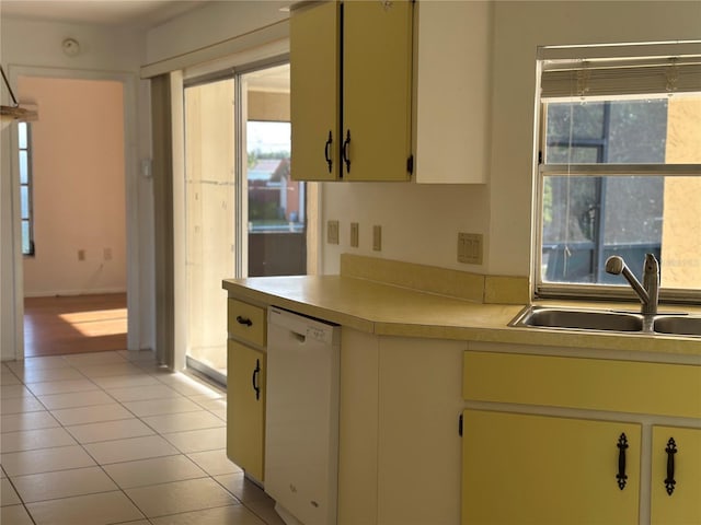 4222 Cockrell St, Port Charlotte, FL 33948 - kitchen with white dishwasher, light countertops, and light tile patterned floors