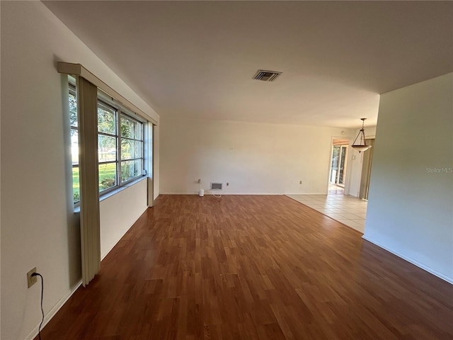4222 Cockrell St, Port Charlotte, FL 33948 - spare room featuring dark wood-type flooring and baseboards