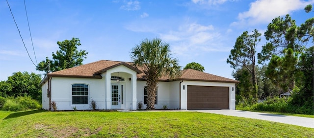 2399 Redstone Ave, North Port, FL 34288 - ranch-style home featuring stucco siding, an attached garage, concrete driveway, and a front lawn