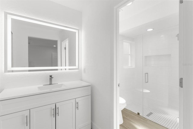2399 Redstone Ave, North Port, FL 34288 - full bathroom featuring vanity, a stall shower, and wood finished floors
