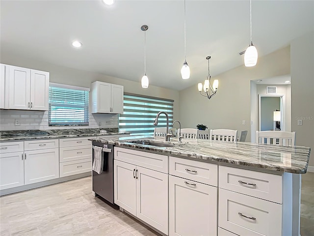 5493 Jody Ave, North Port, FL 34288 - kitchen with dishwasher, light stone counters, white cabinetry, tasteful backsplash, and decorative light fixtures