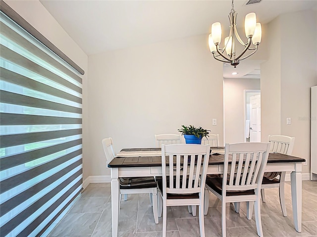 5493 Jody Ave, North Port, FL 34288 - dining area featuring a chandelier and light marble finish flooring