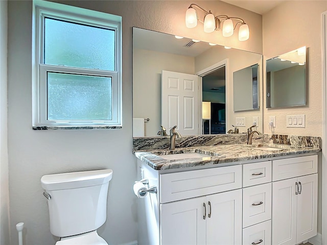 5493 Jody Ave, North Port, FL 34288 - bathroom featuring toilet and double vanity