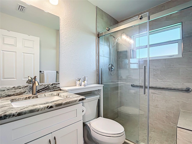 5493 Jody Ave, North Port, FL 34288 - full bath featuring vanity, a shower stall, and a textured wall