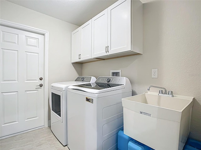 5493 Jody Ave, North Port, FL 34288 - washroom with washing machine and clothes dryer and cabinet space