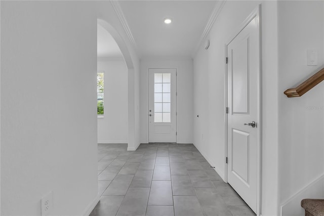 17395 Palmetto Pass Ln, Punta Gorda, FL 33982 - doorway with arched walkways, ornamental molding, light tile patterned floors, and recessed lighting