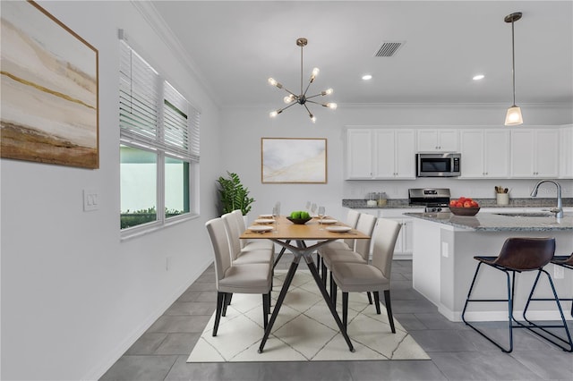 17395 Palmetto Pass Ln, Punta Gorda, FL 33982 - dining area with ornamental molding, a chandelier, light tile patterned flooring, and recessed lighting