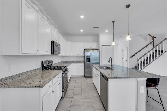 17395 Palmetto Pass Ln, Punta Gorda, FL 33982 - kitchen with appliances with stainless steel finishes, white cabinets, a breakfast bar, light stone counters, and crown molding