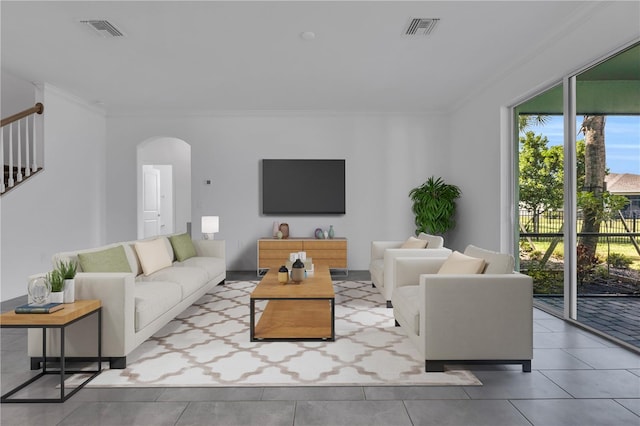 17395 Palmetto Pass Ln, Punta Gorda, FL 33982 - tiled living room featuring crown molding and arched walkways