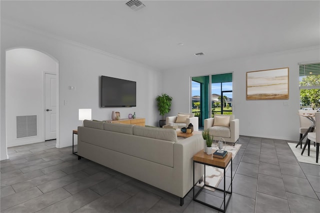 17395 Palmetto Pass Ln, Punta Gorda, FL 33982 - living area with crown molding, arched walkways, and tile patterned floors