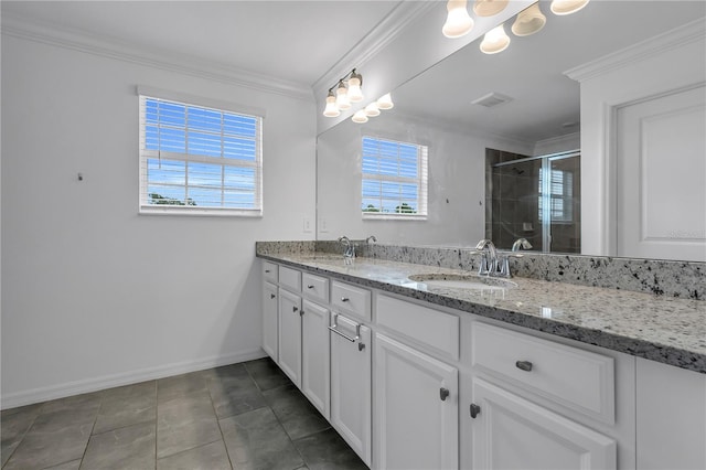 17395 Palmetto Pass Ln, Punta Gorda, FL 33982 - full bathroom with double vanity, healthy amount of natural light, a shower stall, crown molding, and tile patterned flooring