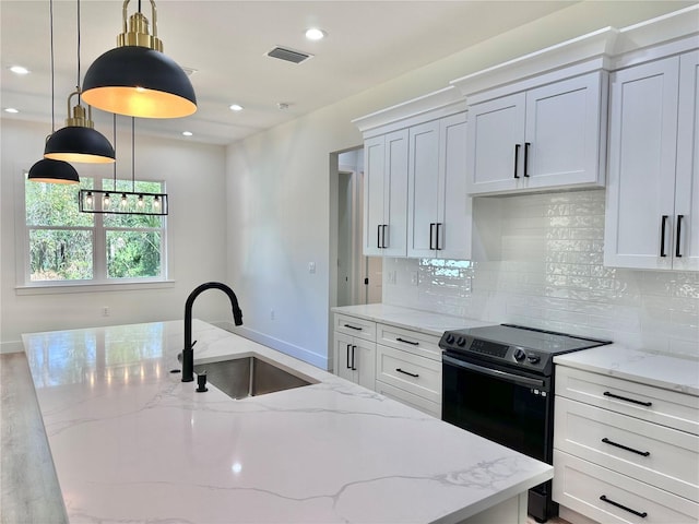 4748 Sylvania Ave, North Port, FL 34286 - kitchen with stainless steel range with electric cooktop, tasteful backsplash, light stone countertops, pendant lighting, and recessed lighting