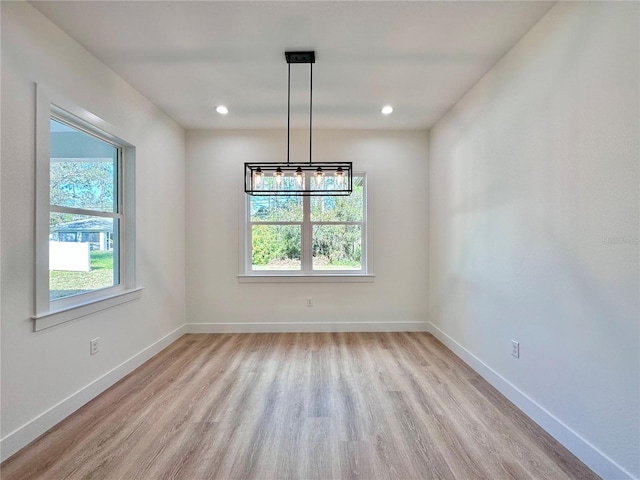 4748 Sylvania Ave, North Port, FL 34286 - unfurnished dining area featuring wood finished floors and recessed lighting
