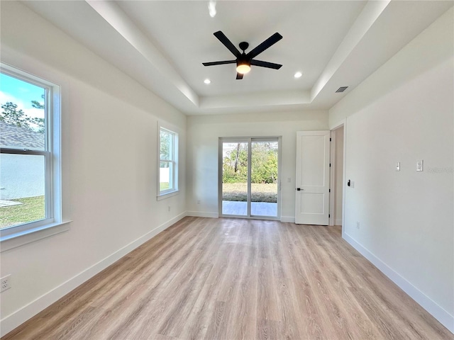 4748 Sylvania Ave, North Port, FL 34286 - spare room featuring light wood finished floors, a raised ceiling, ceiling fan, and recessed lighting