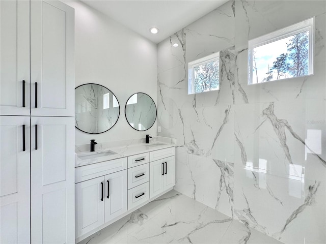 4748 Sylvania Ave, North Port, FL 34286 - full bath featuring double vanity, marble tiled flooring, and recessed lighting