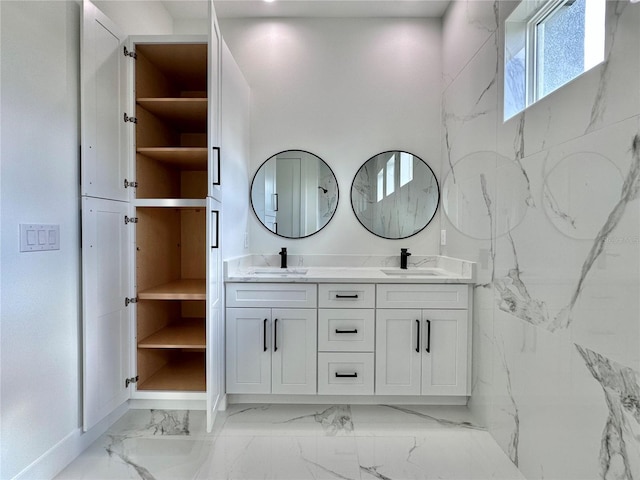 4748 Sylvania Ave, North Port, FL 34286 - bathroom with double vanity and marble look tiles
