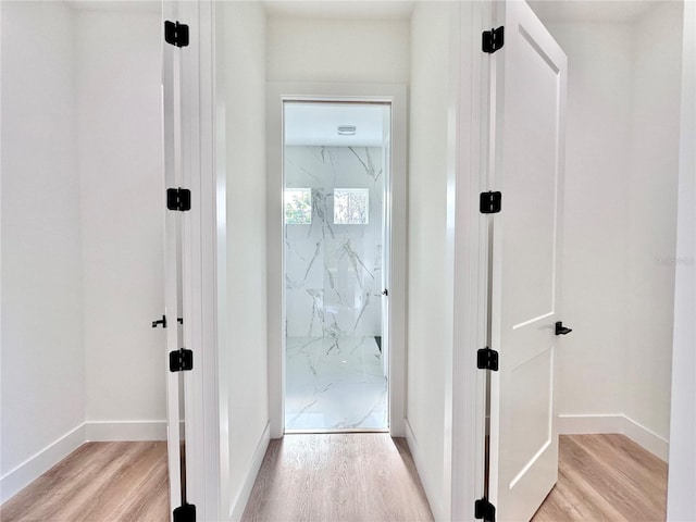 4748 Sylvania Ave, North Port, FL 34286 - corridor with light wood finished floors and baseboards