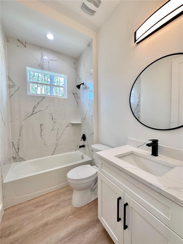 4748 Sylvania Ave, North Port, FL 34286 - full bathroom with vanity, wood finished floors, shower / bath combination, and recessed lighting