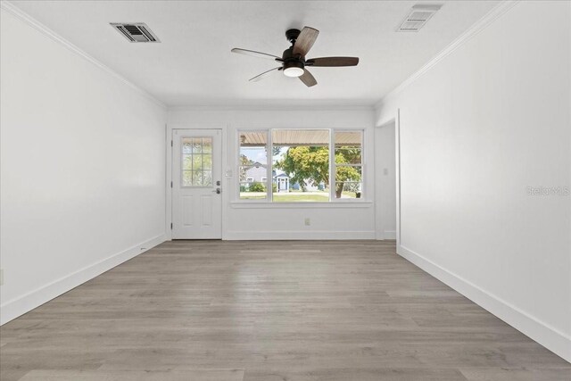 315 Durrance St, Punta Gorda, FL 33950 - spare room featuring ornamental molding, a ceiling fan, and light wood finished floors