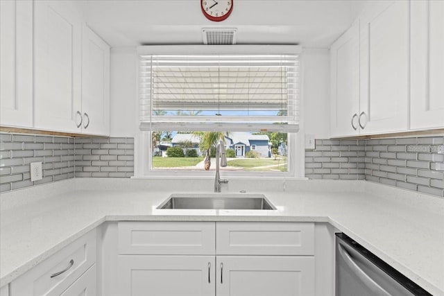 315 Durrance St, Punta Gorda, FL 33950 - kitchen featuring dishwasher, white cabinetry, and light countertops