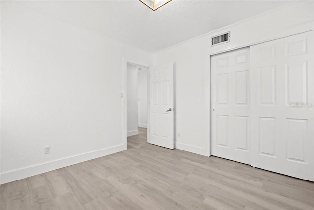 315 Durrance St, Punta Gorda, FL 33950 - unfurnished bedroom featuring wood finished floors and a closet
