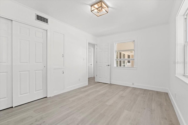 315 Durrance St, Punta Gorda, FL 33950 - unfurnished bedroom featuring light wood-style flooring and a closet