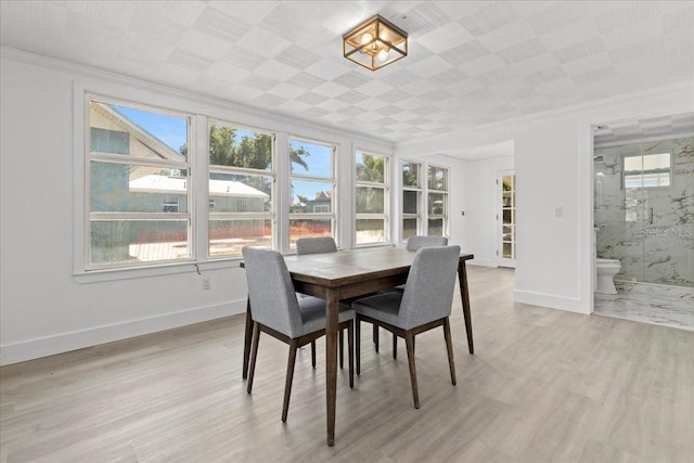 315 Durrance St, Punta Gorda, FL 33950 - dining room featuring ornamental molding and light wood-style floors