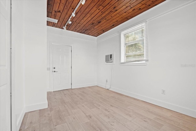 315 Durrance St, Punta Gorda, FL 33950 - spare room with wooden ceiling, track lighting, a wall mounted AC, and light wood-type flooring