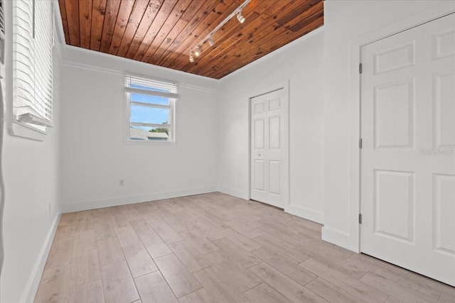 315 Durrance St, Punta Gorda, FL 33950 - unfurnished bedroom with track lighting, wooden ceiling, light wood-type flooring, a closet, and crown molding