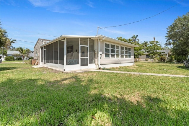 315 Durrance St, Punta Gorda, FL 33950 - back of property featuring a sunroom and a yard