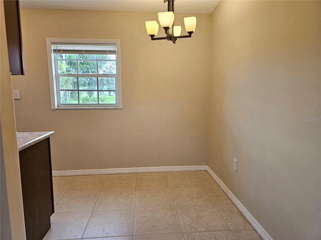 21552 Holdern Ave, Port Charlotte, FL 33952 - unfurnished dining area with baseboards and a chandelier