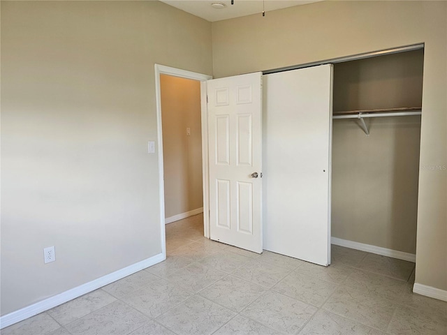 21552 Holdern Ave, Port Charlotte, FL 33952 - unfurnished bedroom with a closet and light tile patterned flooring