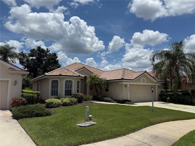 2760 Royal Palm Dr, North Port, FL 34288 - mediterranean / spanish house featuring a garage, stucco siding, concrete driveway, a front yard, and a tiled roof