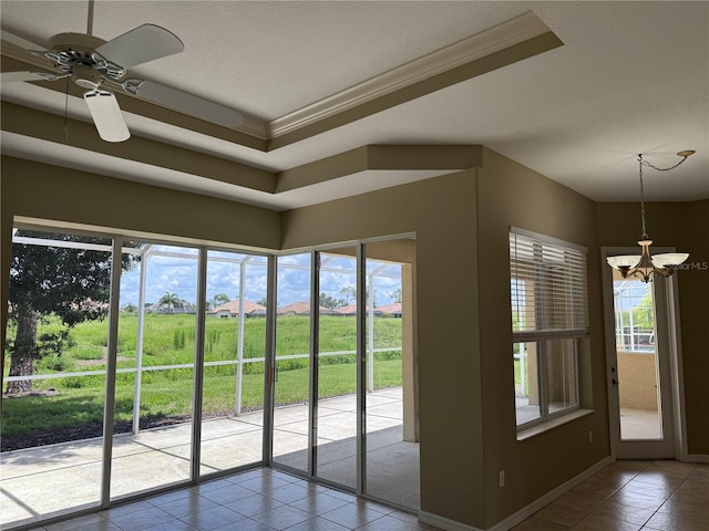 2760 Royal Palm Dr, North Port, FL 34288 - entryway with a chandelier, tile patterned flooring, plenty of natural light, a ceiling fan, and crown molding