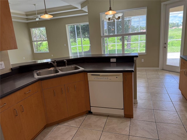 2760 Royal Palm Dr, North Port, FL 34288 - kitchen featuring white dishwasher, dark countertops, light tile patterned floors, and decorative light fixtures