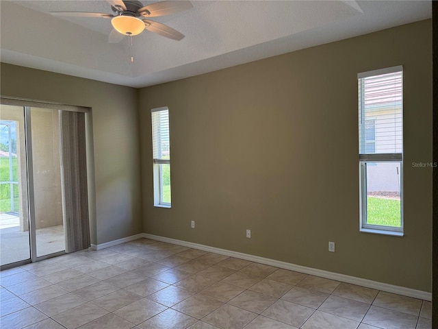 2760 Royal Palm Dr, North Port, FL 34288 - spare room featuring plenty of natural light, light tile patterned floors, and ceiling fan