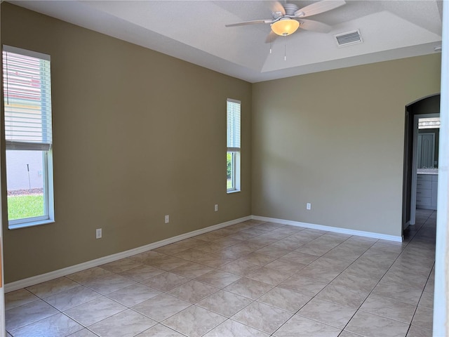 2760 Royal Palm Dr, North Port, FL 34288 - unfurnished room featuring arched walkways, a ceiling fan, and light tile patterned floors