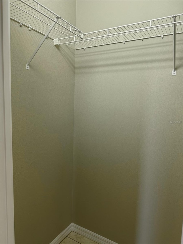 2760 Royal Palm Dr, North Port, FL 34288 - walk in closet featuring light tile patterned flooring