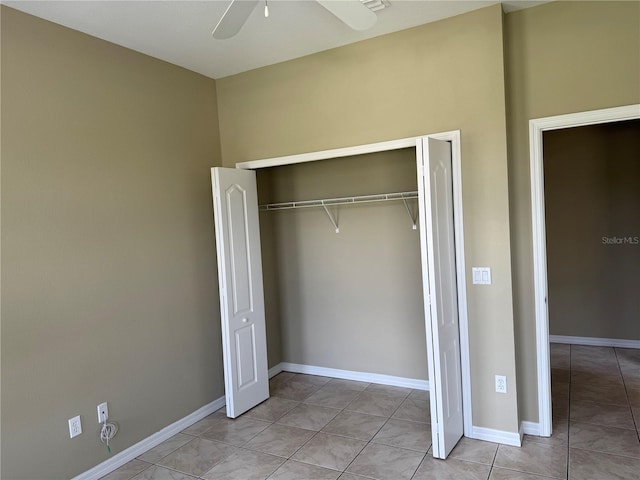 2760 Royal Palm Dr, North Port, FL 34288 - unfurnished bedroom with a closet, light tile patterned floors, and a ceiling fan