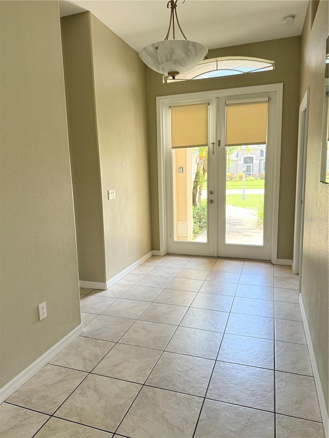 2760 Royal Palm Dr, North Port, FL 34288 - entryway with light tile patterned flooring, a textured wall, and french doors