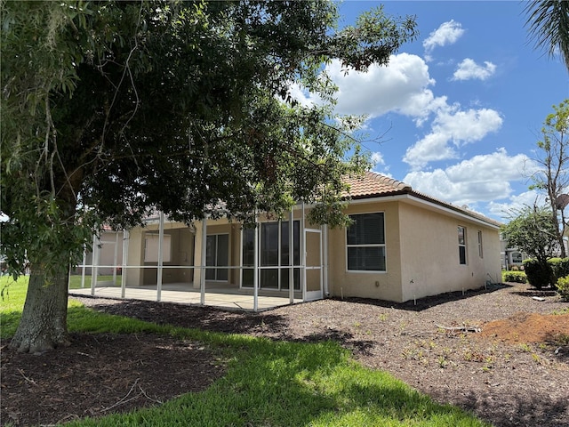 2760 Royal Palm Dr, North Port, FL 34288 - back of property with stucco siding, a patio, and a tiled roof