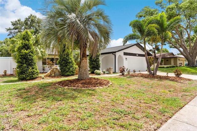 11772 96th Pl, Seminole, FL 33772 - view of front of home featuring a garage, stucco siding, and concrete driveway