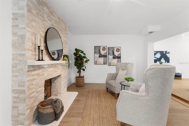 11772 96th Pl, Seminole, FL 33772 - living area with wood finished floors and a large fireplace